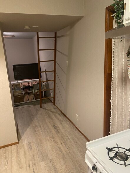 View from kitchen to living room (TV blocks view of living rm) - 415 10th St