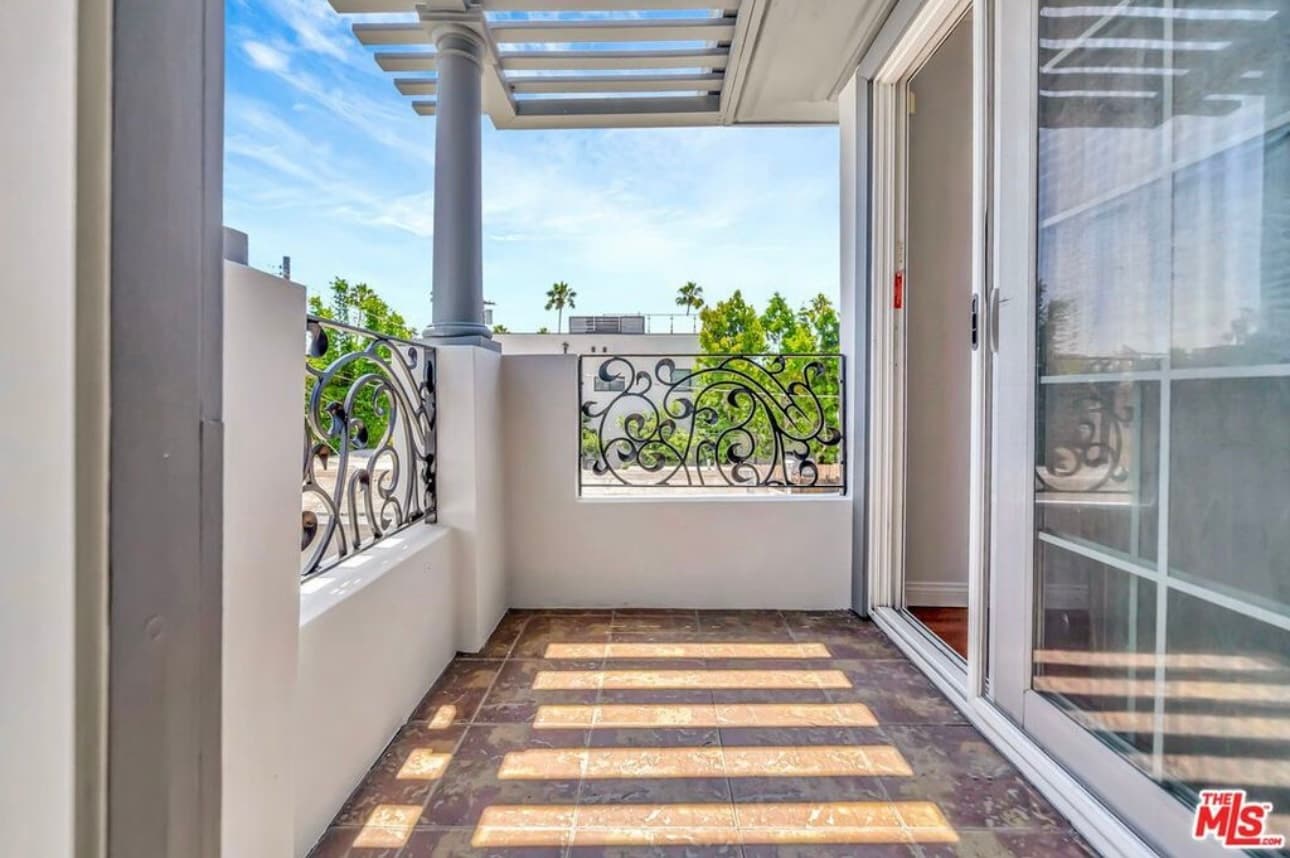Balcony (access from dining room and primary bedroom). - 3242 Hutchison Ave