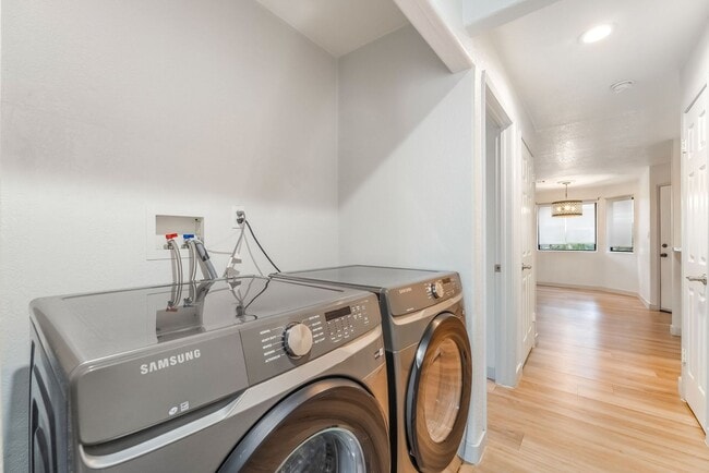 Building Photo - Upgraded Three-Bedroom Condo with Wood Flooring and Modern Comforts!