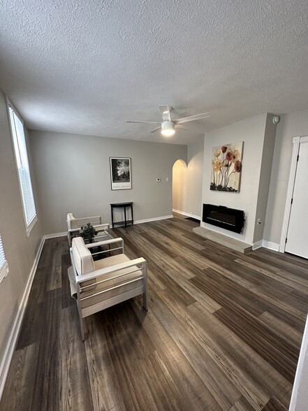 Living room with electric fireplace. - 819 Central Ave