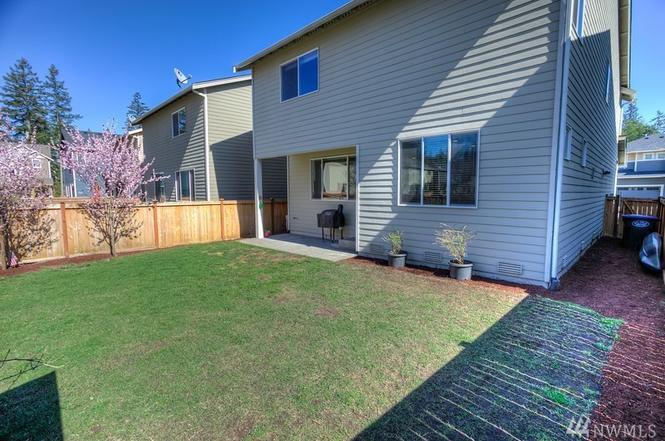 Backyard, fully fenced. - 8828 Jayden Ln NE