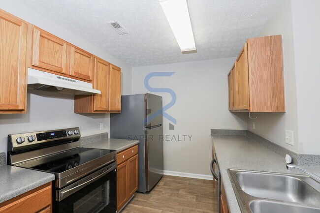 Building Photo - Move in before January 31st and choose your reward: a $250 Amazon Gift Card or a 55" Smart TV!