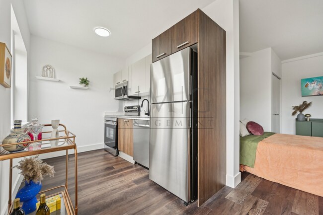 Building Photo - Brand New Studio with Luxe Finishes & Natu...