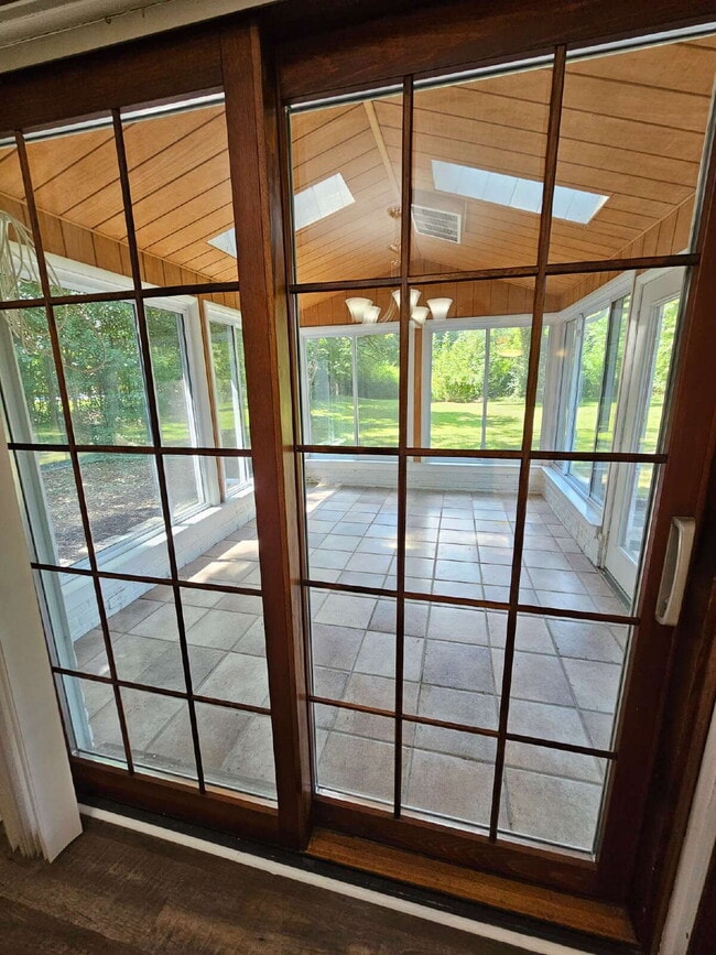 Building Photo - Private 4 Bedroom Home on 0.75 Acres with Great Room Fireplace, Wet Bar & 3-Season Room, 2 Car At...