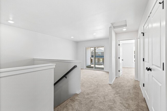 Building Photo - New 3 Bed Townhome with Covered Deck and Oversized Garage!