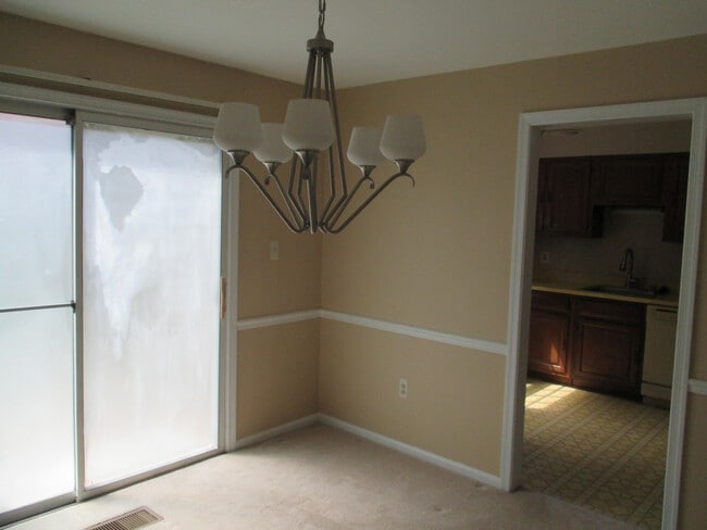 Building Photo - SPACIOUS BRICK TOWN-HOME