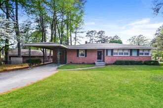 Building Photo - Charming Brick Home with Outdoor Deck