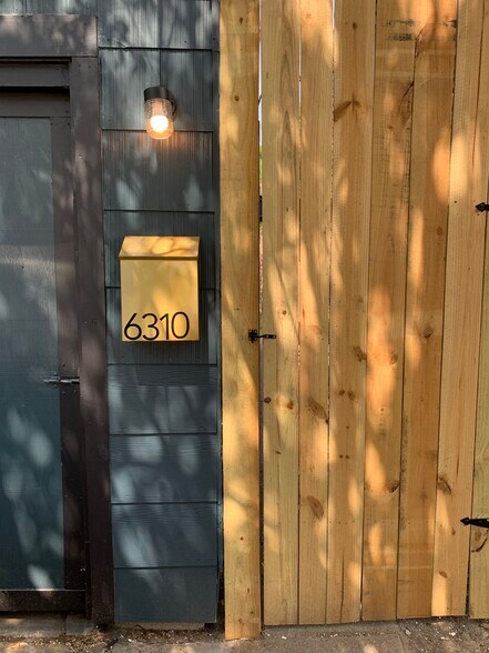 Front with secured gate - 6310 Greenbriar Dr