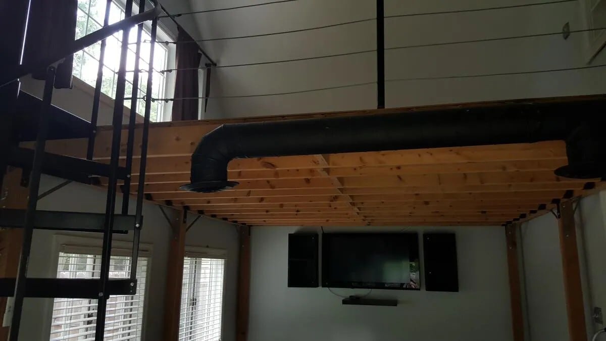 View looking up to loft from living room. - 91 Waterman Ave