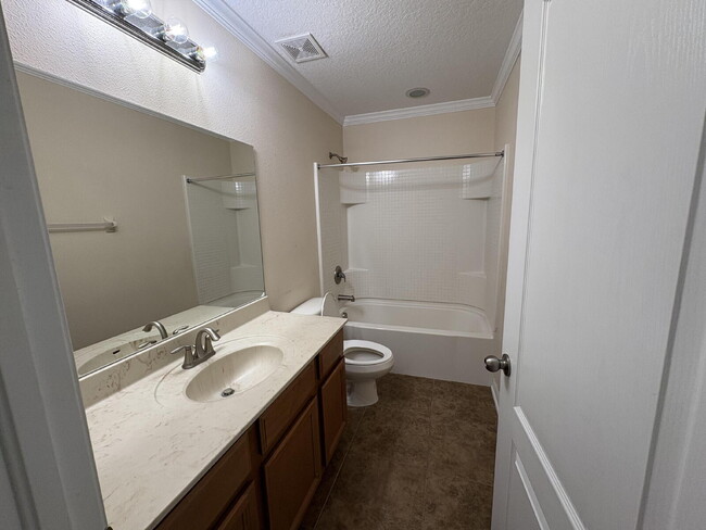 Building Photo - Spacious 5-Bedroom Pool Home with Putting ...