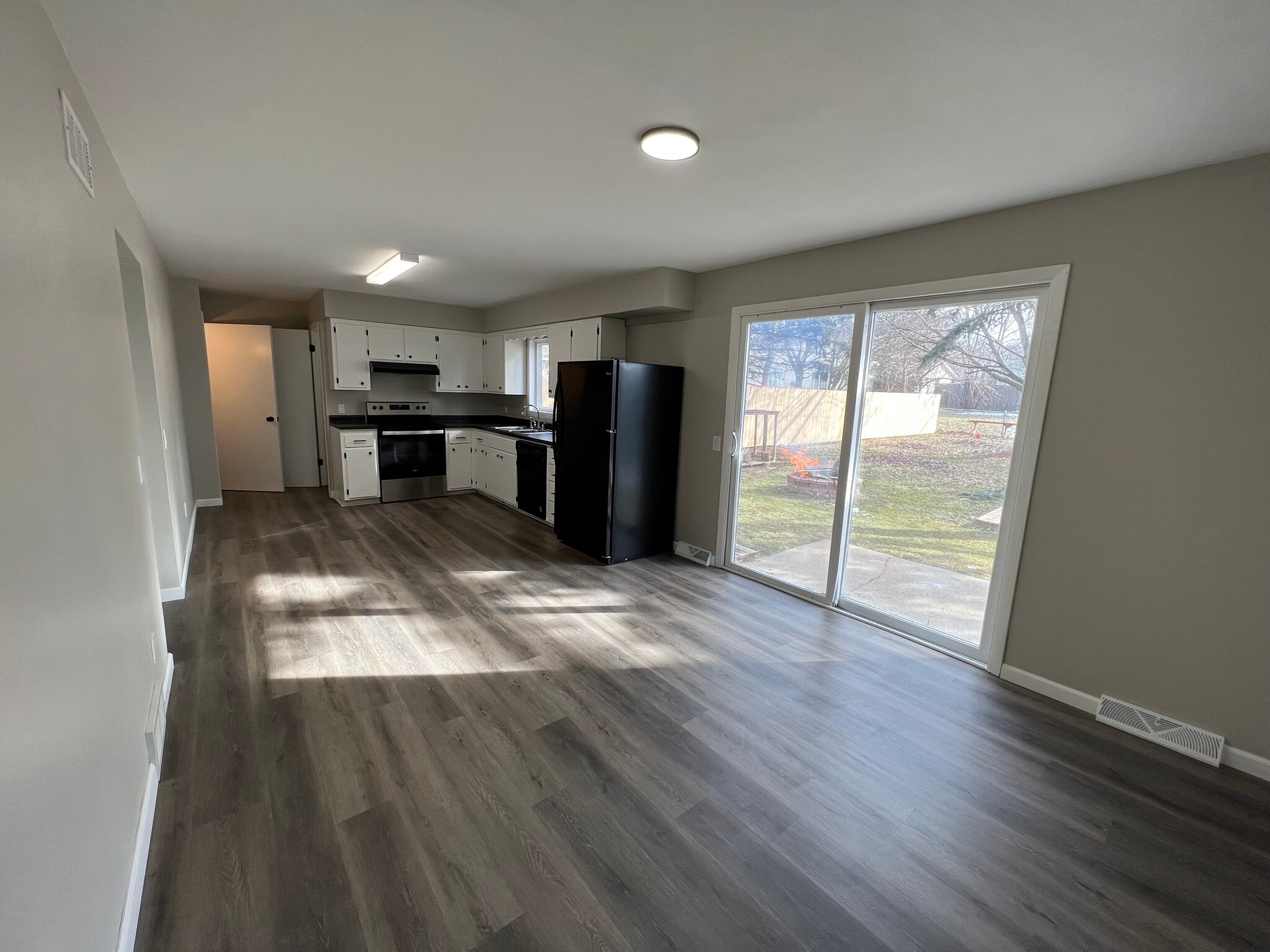 Dining and Kitchen (Half Bath on Right, Basement on Left) - 2951 Traceway Dr