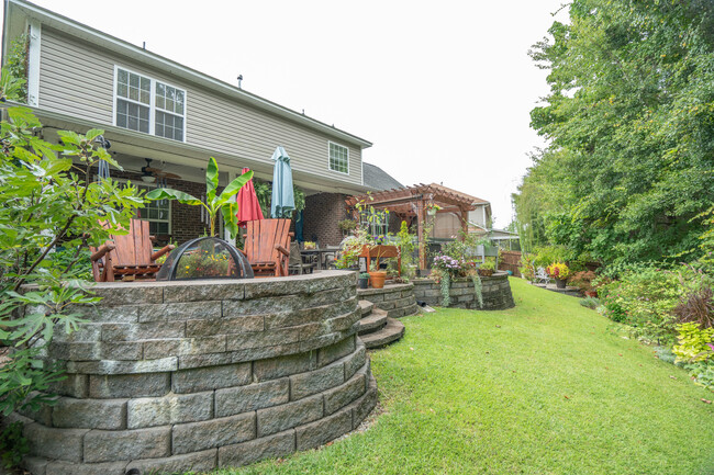 Stone Fire pit and built in seating - 286 Traditions Cir