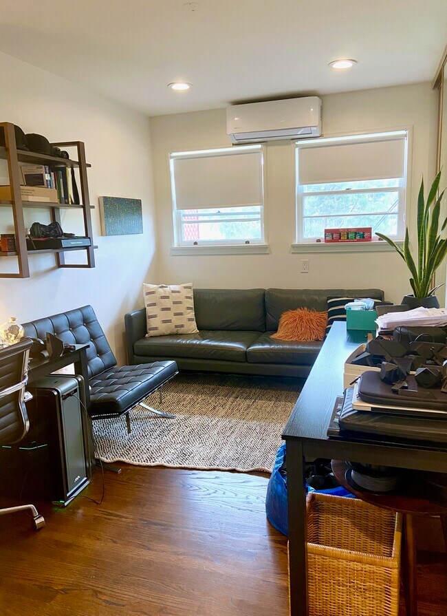 Second bedroom shown as a furnished home office. - 1672 Rotary Dr