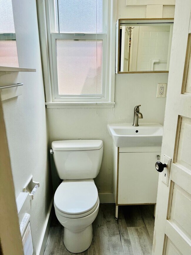 Building Photo - Crisp Duplex, offstreet parking, great backyard too.