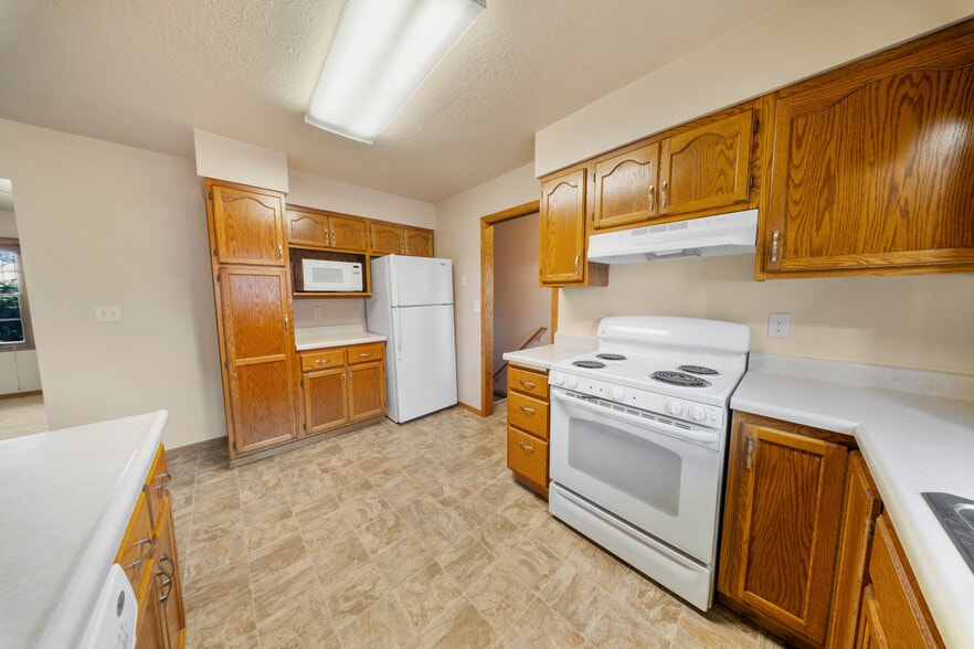 Kitchen to stairway down - 2405 W 28th St
