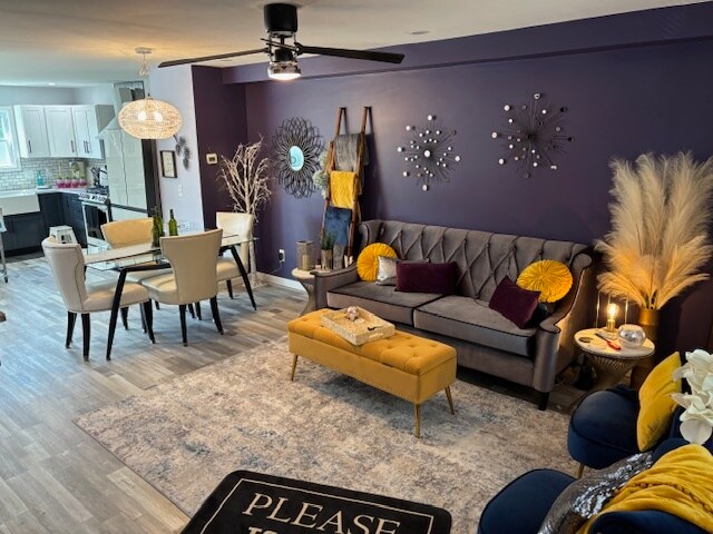 Relax in the shared living space equipped with fireplace and 65 in flat screen TV - 15 Brandywine Dr