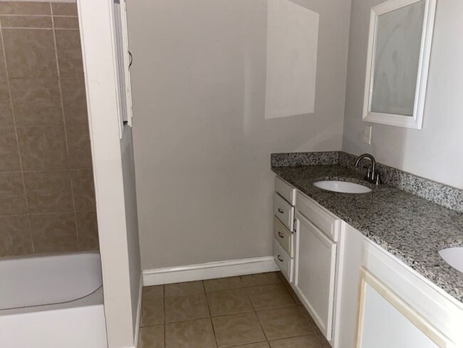 Building Photo - Three bedroom two bath house ready for a n...