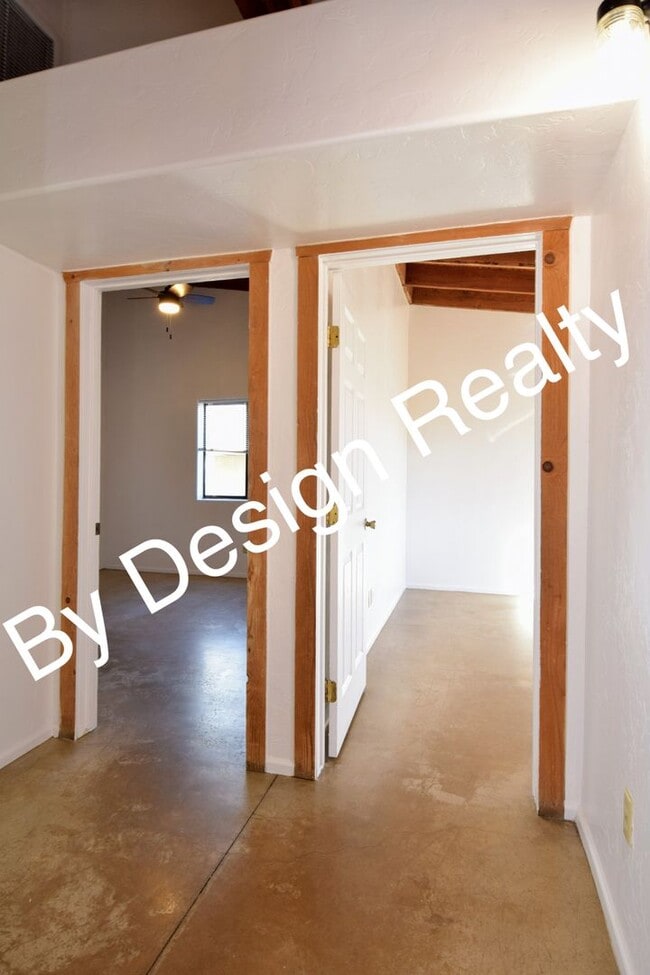 Building Photo - Charming Mid-Century Style: Vaulted Beams & Private Oversized Yard