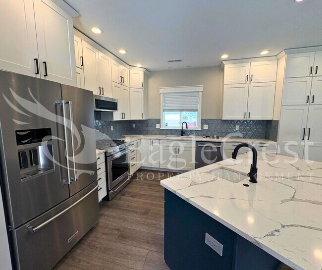 Building Photo - Contemporary Home With A Covered Patio & Quartz Countertops