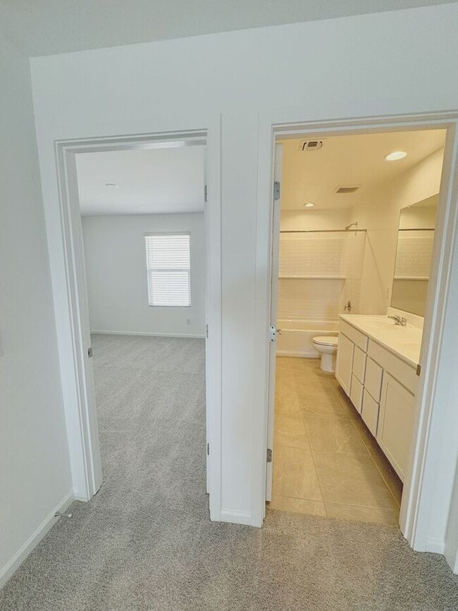 Building Photo - MOVE IN SPECIALS!! ONE MONTH RENT FREE!! New 5-Bedroom Home in Phoenix with Upgrades!