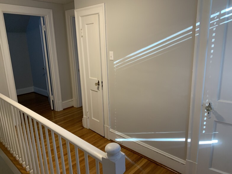 Upstairs hallway with linen closet - 166 Montague St