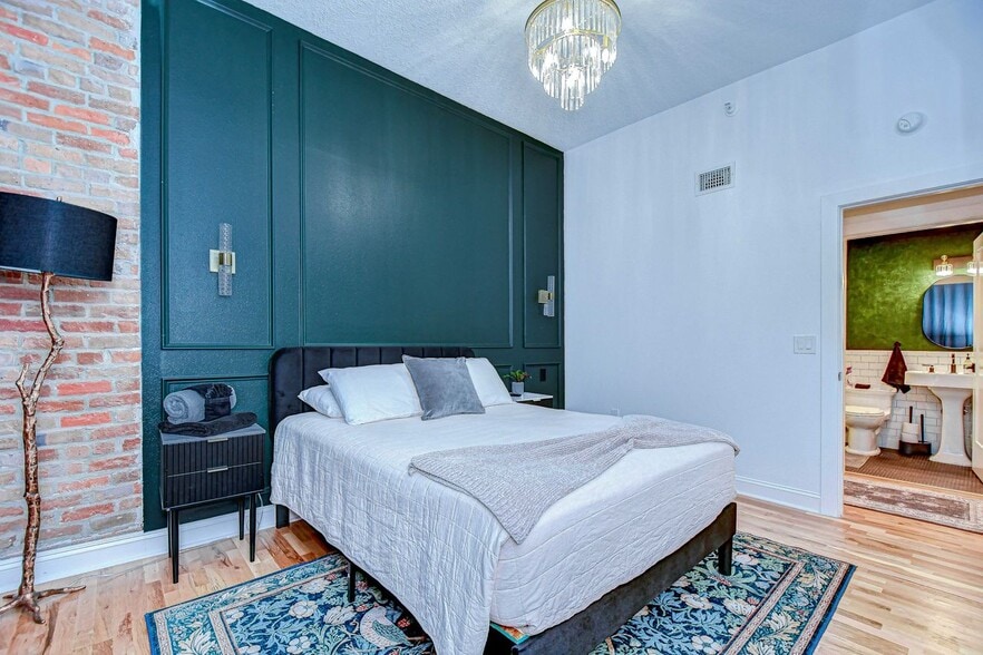 guest bedroom features a queen size bed and large walk in closet - 215 Central Ave