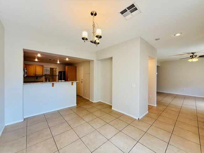 Building Photo - Immaculate and Inviting Two-Story Condo in...