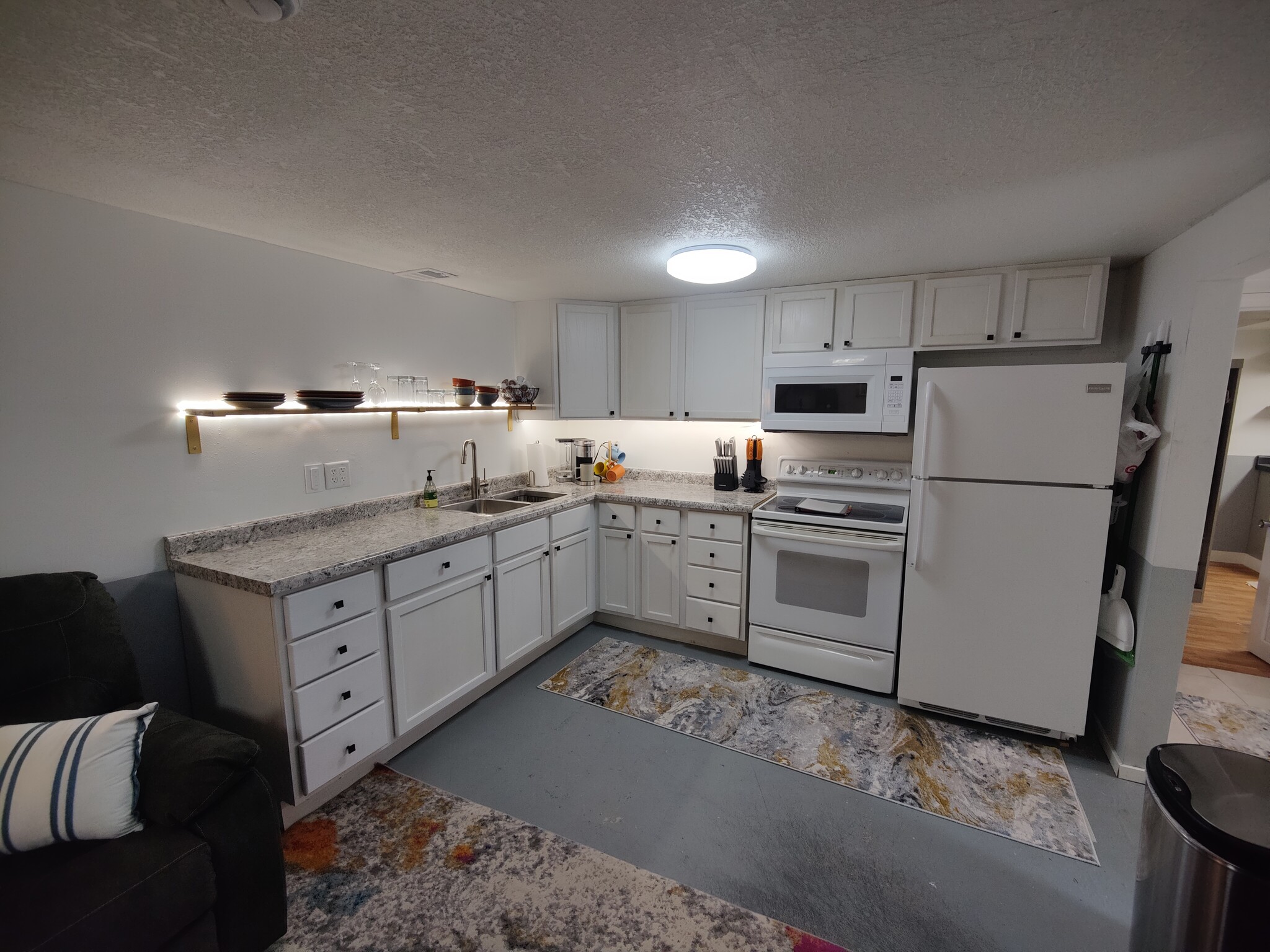 Full kitchen with included dishes and cookware. - 2913 Clover St