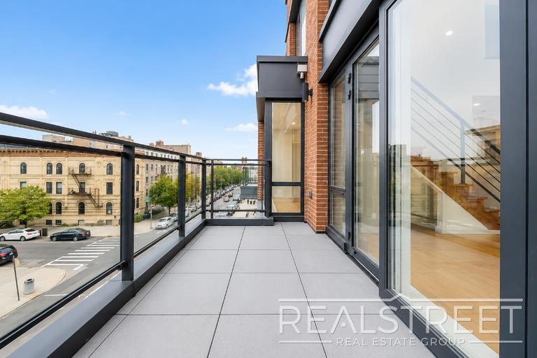 Building Photo - Sun-Filled Penthouse Duplex with Massive Private Terrace & Bonus Storage Room