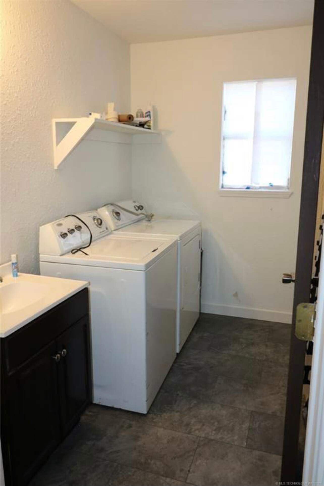 Bathroom has washer and dryer hook ups. Washer and dryer not included. - 305 W Adler Ave