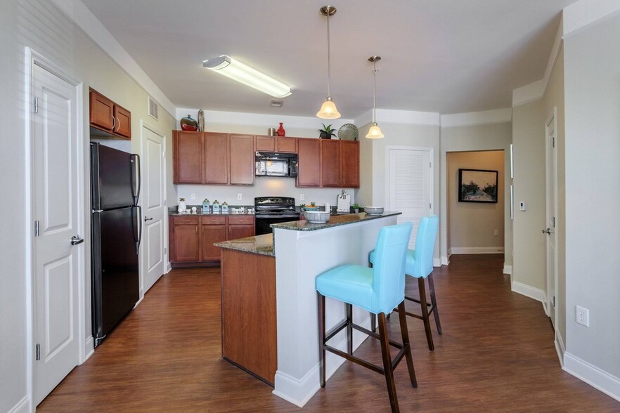 Open Floor Plan Kitchen Area - The Retreat at Quail North Apartments