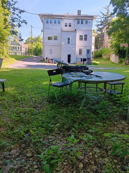 backyard with large parking lot - 523 E State St