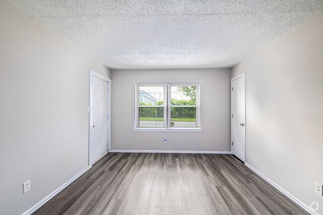 2BR, 1BA - 800SF - Living Room - Derita Woods Apartments