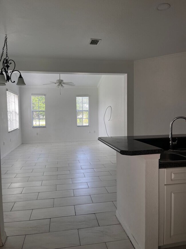 Building Photo - COMING SOON! Space, Style & Serenity! Enjoy comfortable living in this beautiful 4-bedroom home f...
