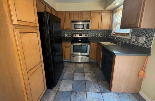 Building Photo - Charming Remodeled Townhome in Raleigh West - Prime Location w/ Garage & Private Patio