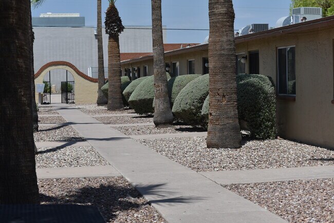 Center walkway through complex - 909 S Priest Dr