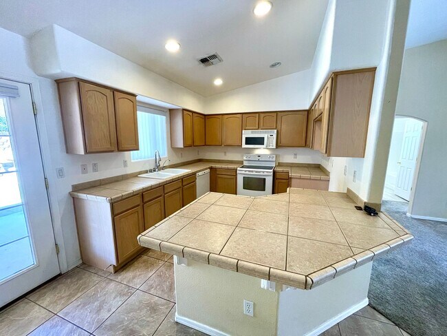 Building Photo - Inviting 3 Bedroom Home with RV Parking an...