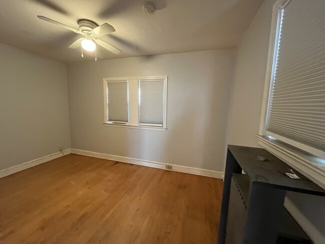 back room with ceiling fan - 1417 West 37th Street