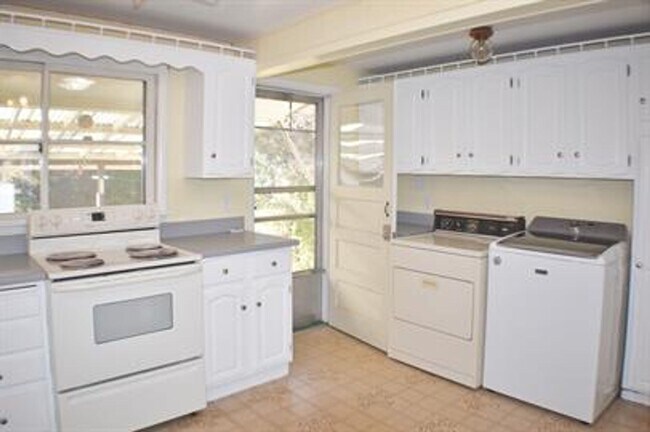 Building Photo - Updated house with original hardwoods and 2-car garage!