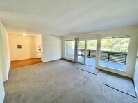 Building Photo - Sunlit 2BD/1BA w/ Private Balcony + Backyard! New Carpet! Assigned Parking! PROGRESSIVE
