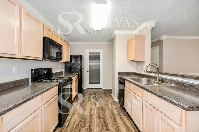 Building Photo - The living is easy in this gorgeous 4BR, 2.5BA brick home