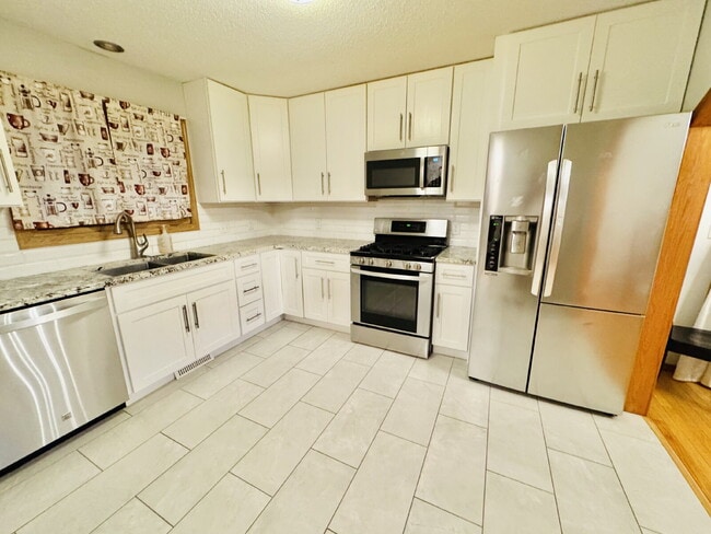 Building Photo - "Charming 4-Bedroom Home with Granite Elegance & Hardwood Warmth in Savage!"