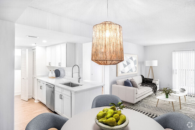 Discover newly renovated interiors in select homes, complete with brand new stainless-steel appliances, quartz countertops, modern cabinetry, and stylish vinyl plank flooring. - Windsor Coconut Creek