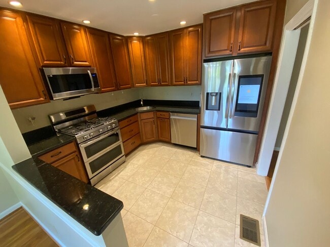 Building Photo - A fully updated Four Bedroom, Three and On...