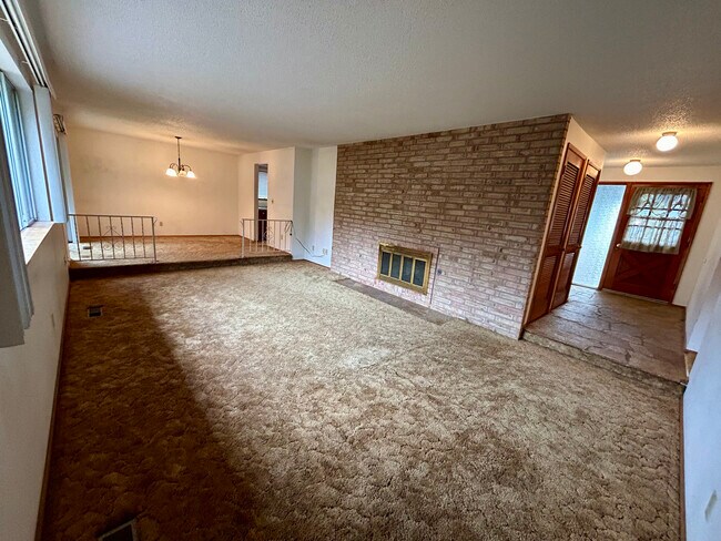 Family Room/Dining Area & Entry Foyer - previous pic to show floorplan. No carpet now vinyl floor vi - 8519 49th St W