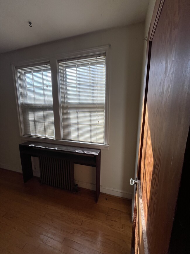 middle room with plant stand on radiator - 1417 West 37th Street