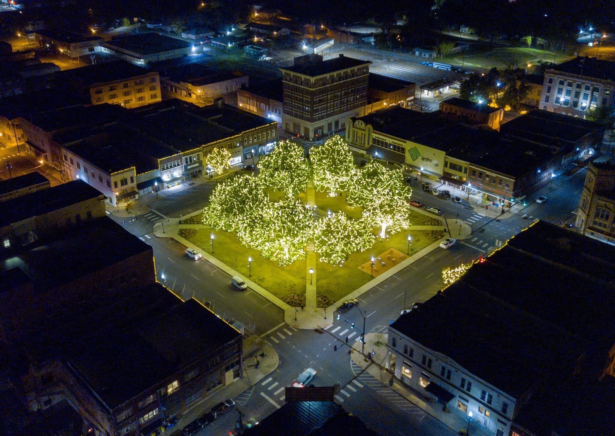 view of the square at night in downtown paris texas. - 7 W Houston St