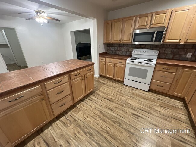 Building Photo - Charming 4-Bedroom Brick Ranch with Spacio...