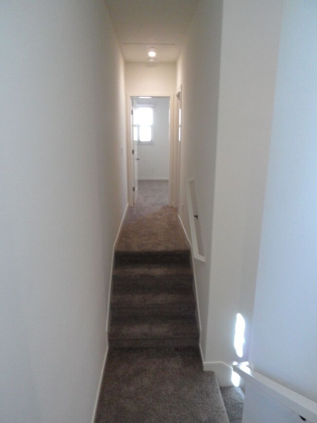 Building Photo - 4BR 3BA two-story condo with 2 Car Attache...