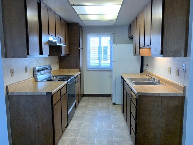 Building Photo - ENJOY THE POOL THIS SUMMER IN THIS GATED C...